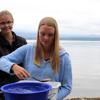 Chrissy Schellenberg helps a local using the "vortex method" for the first time.