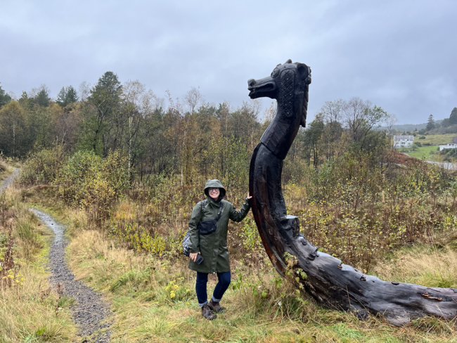 Alanna with wooden craving in Norway