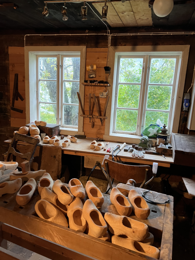 Inside a Norwegian wooden shoe workshop with clogs and tools 